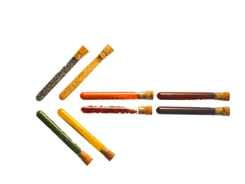 Studio shot of Test Tubes making Arrow shape on white background. Photo : David Arky