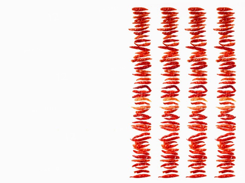 Studio shot of Red Chili Peppers on white background. Photo: David Arky