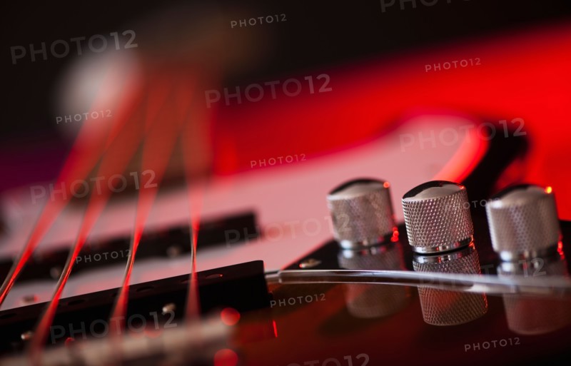 Close up of volume knobs of bass guitar. Photo: Daniel Grill