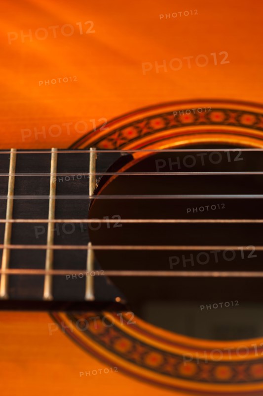 Close up of sound hole of acoustic guitar. Photo: Daniel Grill