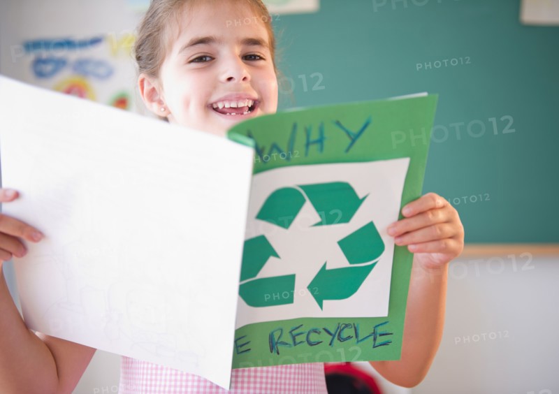 Portrait of schoolgirl ( 6-7) presenting environmental knowledge. Photo : Jamie Grill