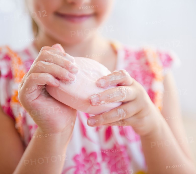 Close up girl (6-7) washing hands. Photo: Jamie Grill