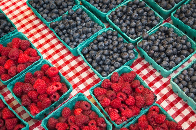 Raspberries and blueberries in cartons. Photo : Gary J Weathers