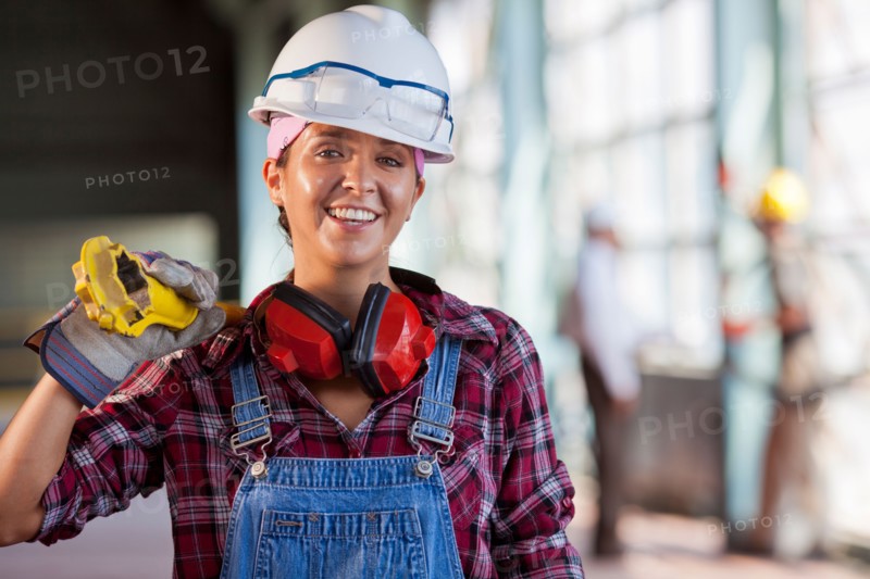 Portrait of female manual worker wearing hardhat. Photo: db2stock