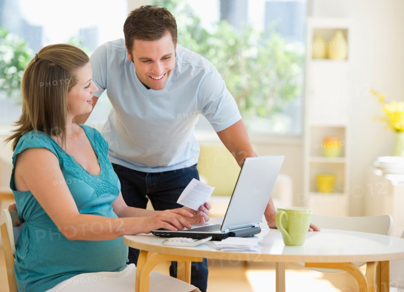 Young couple using laptop.
