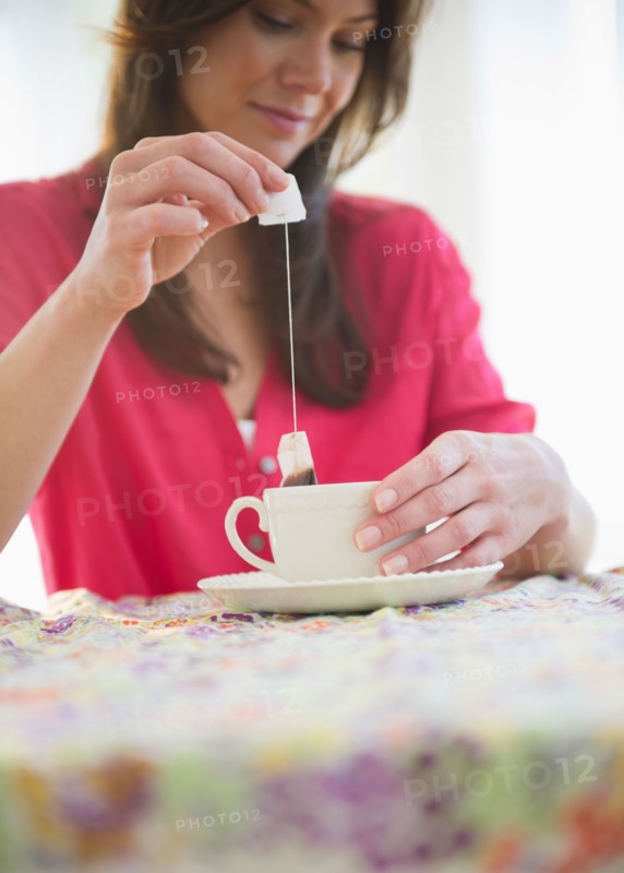 Woman preparing tea. Photo: Jamie Grill