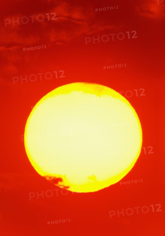 Close-up of large red sun.