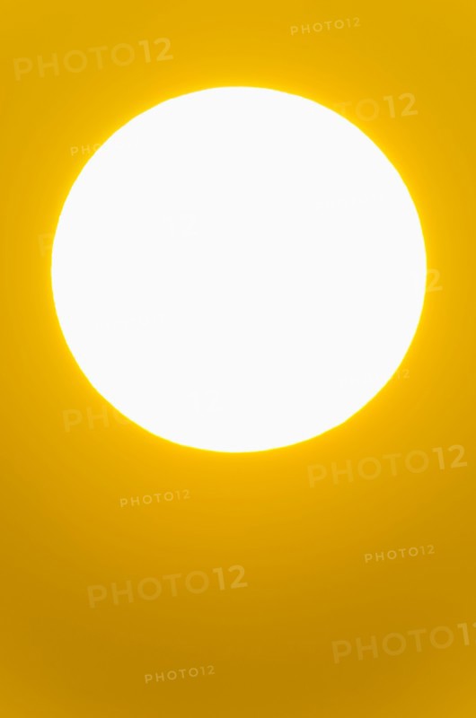 Close-up of large red sun.