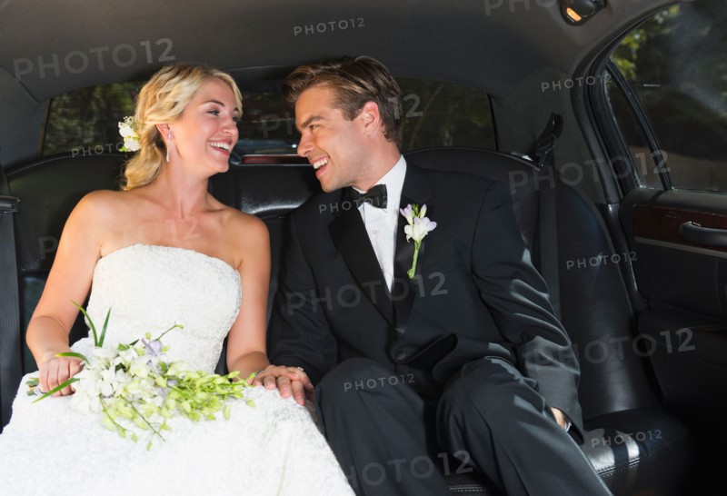 Married couple in limousine.