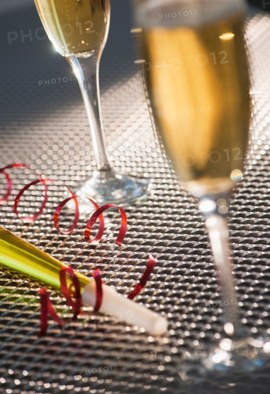 Flutes with champagne and party horn blower. Photo: Daniel Grill