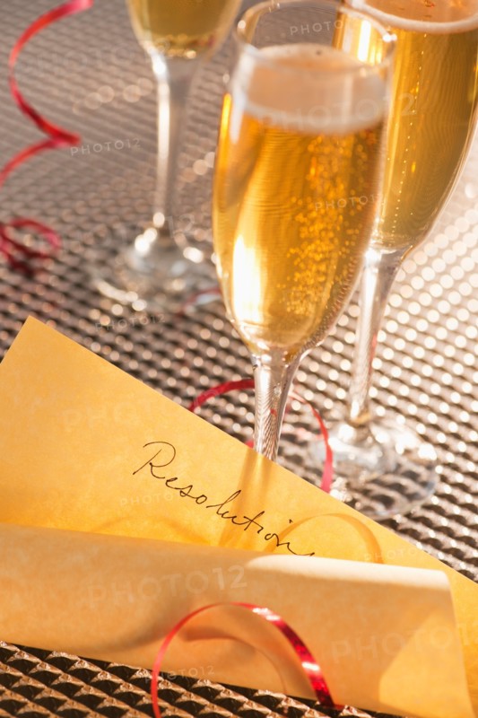 Flutes with champagne and list of resolutions. Photo : Daniel Grill