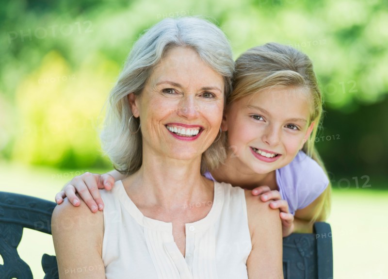 Portrait of grandmother with granddaughter (10-11) .