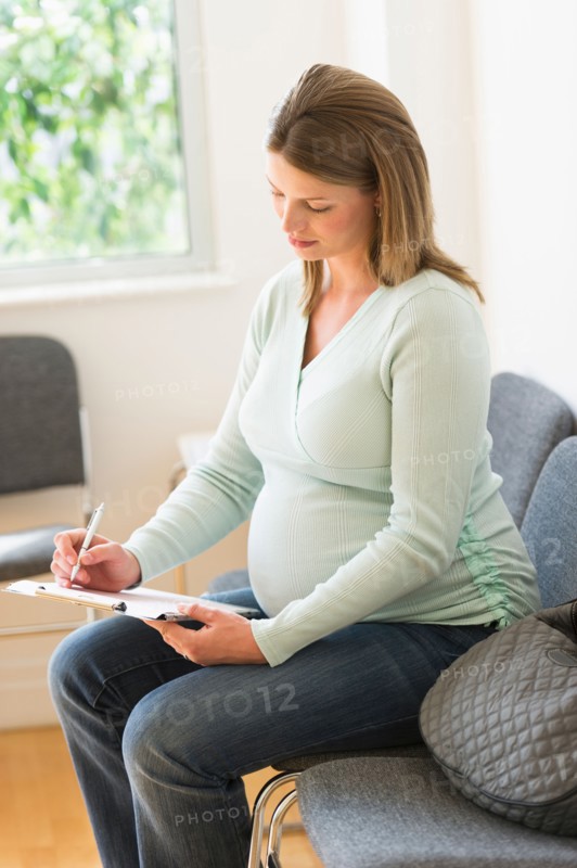 Young woman in doctor's waiting room.