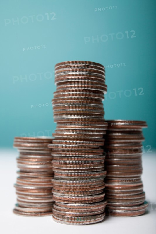 Studio shot of stacks of coins. Photo : Winslow Productions