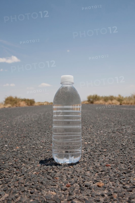 Water bottle sitting in middle of desert road. Photo: Winslow Productions