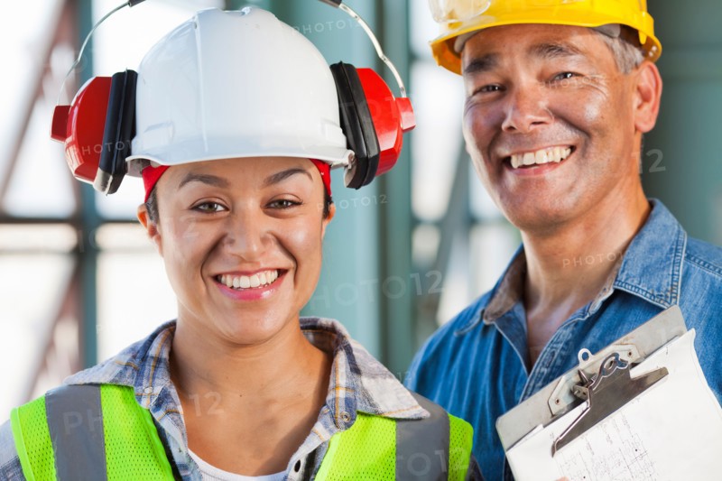 Portrait of male and female manual workers. Photo: db2stock