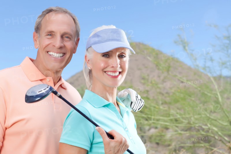 Portrait of couple on golf course. Photo : db2stock