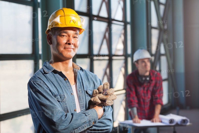 Portrait of worker wearing hardhat. Photo : db2stock