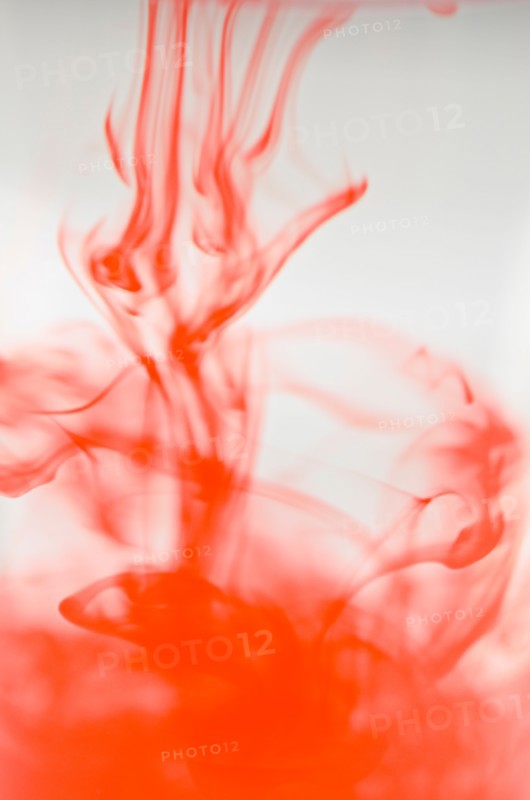 Studio shot of red liquid dissolving in water. Photo: Antonio M. Rosario