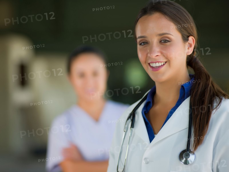 Portrait of female doctor, healthcare worker in background. Photo: db2stock