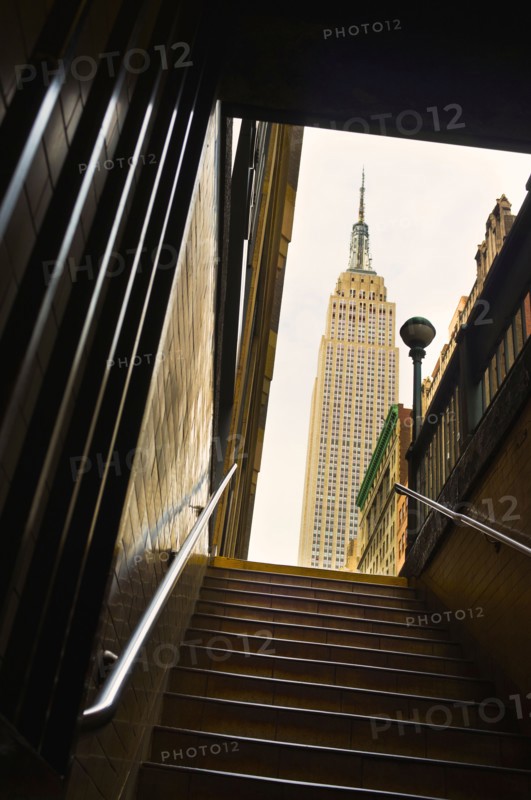 Empire State Building as seen from subway station staircase.