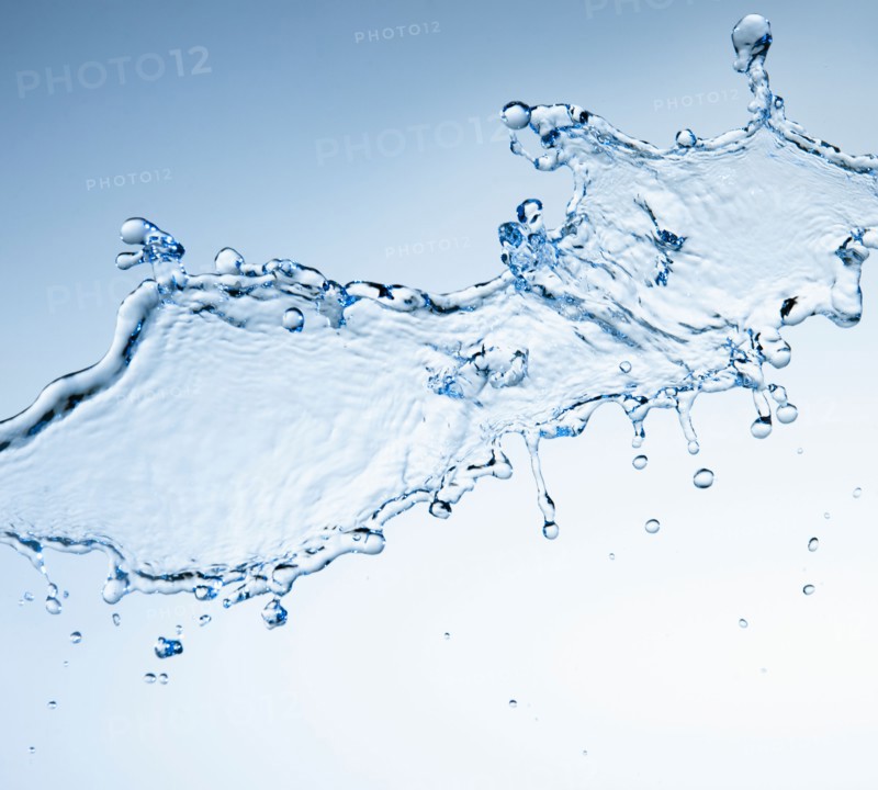 Studio shot of water splash on blue background.