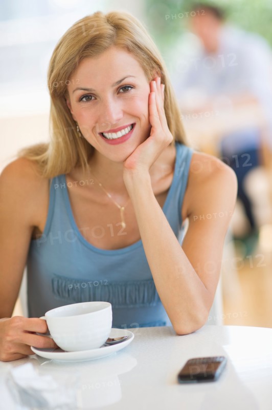 Portrait of mid adult woman drinking coffee.