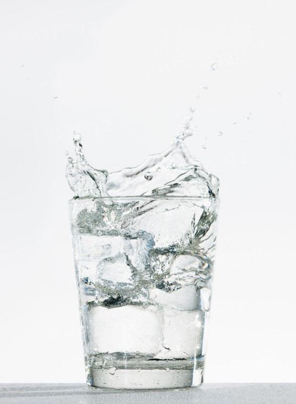 Studio shot of glass of water with splash.