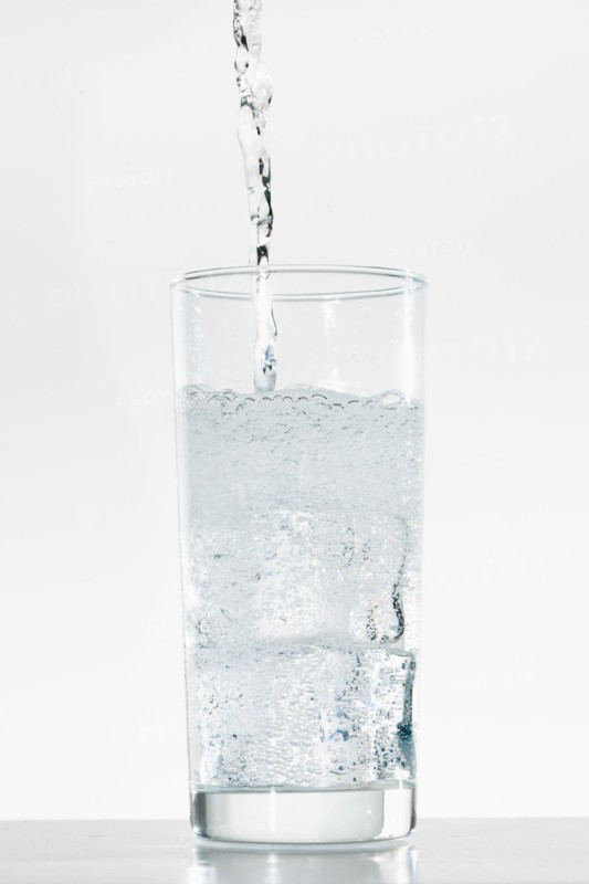 Studio shot of water being poured into glass.