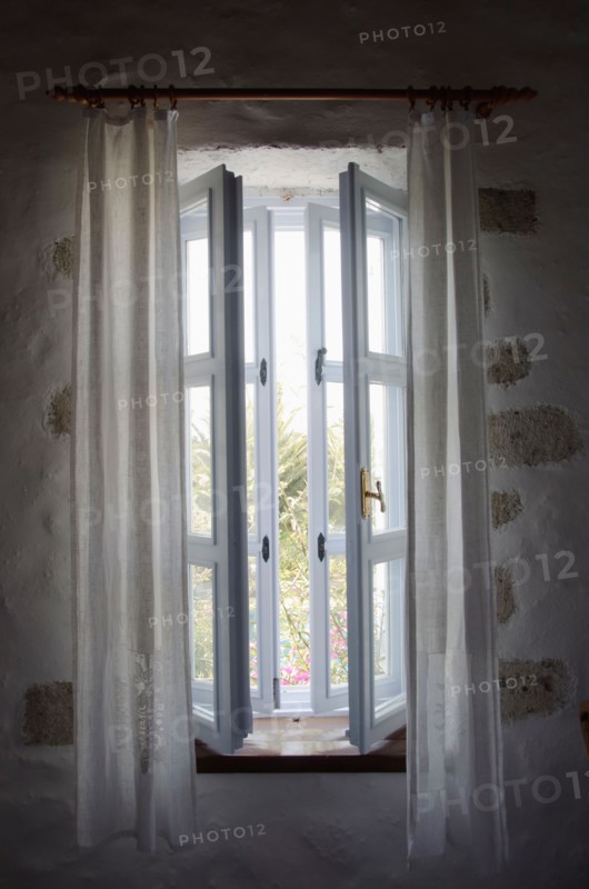 Turkey, Cesme, Alacati, open window in house. Photo: Tetra Images