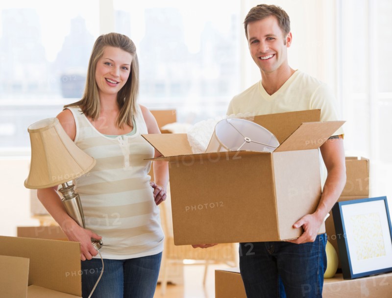Young couple unpacking.