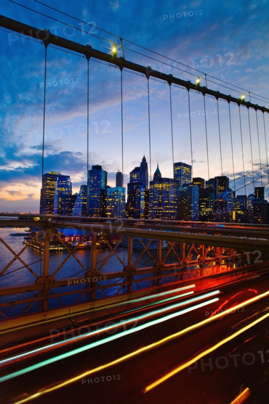 USA, New York State, New York City, Lower Manhattan and Brooklyn Bridge at dusk.