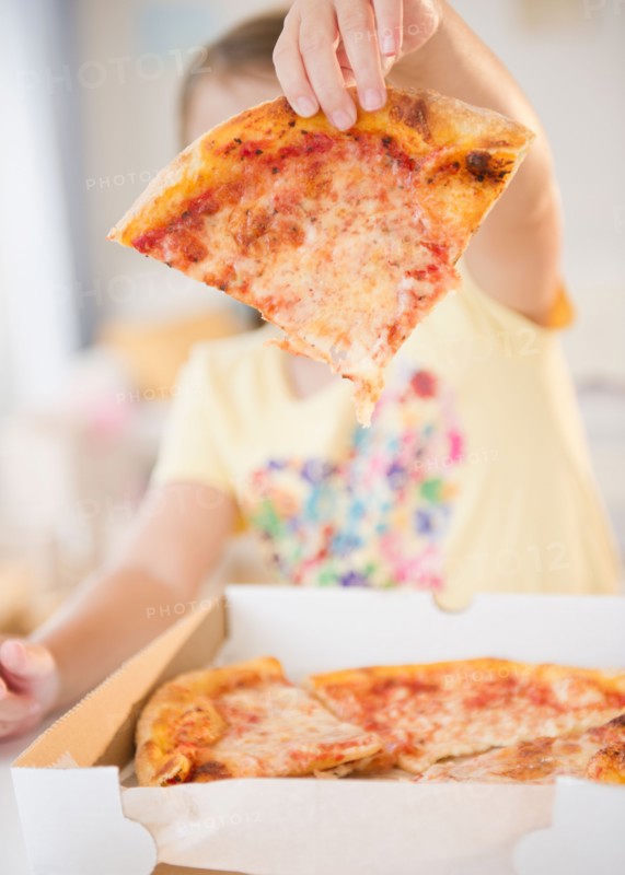 Girl ( 6-7) showing slice of pizza. Photo: Jamie Grill