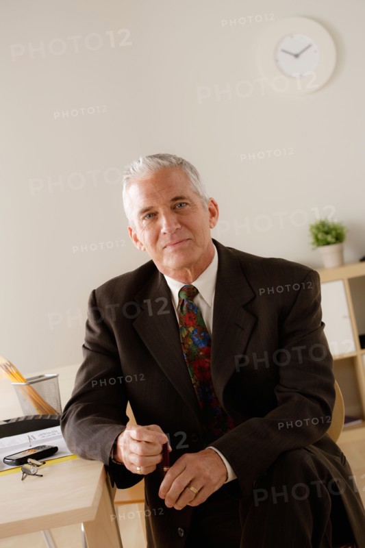 Portrait of smiling senior businessman. Photo : Rob Lewine