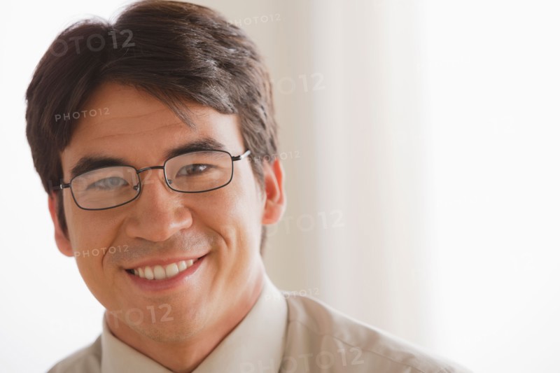 Portrait of business man smiling. Photo : Rob Lewine