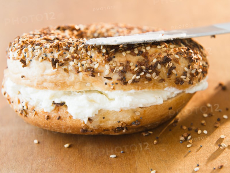 Close up of bagel with cream cheese. Photo : Jamie Grill
