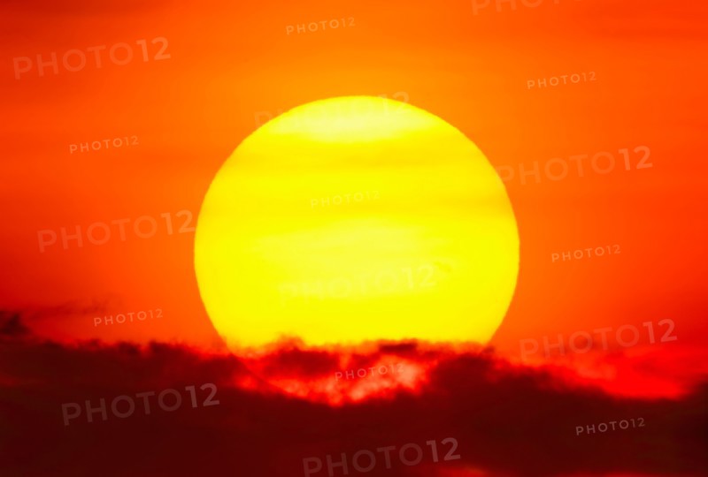 Large sun at sunset.