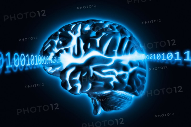 Brain radiating light and numbers, studio shot.
