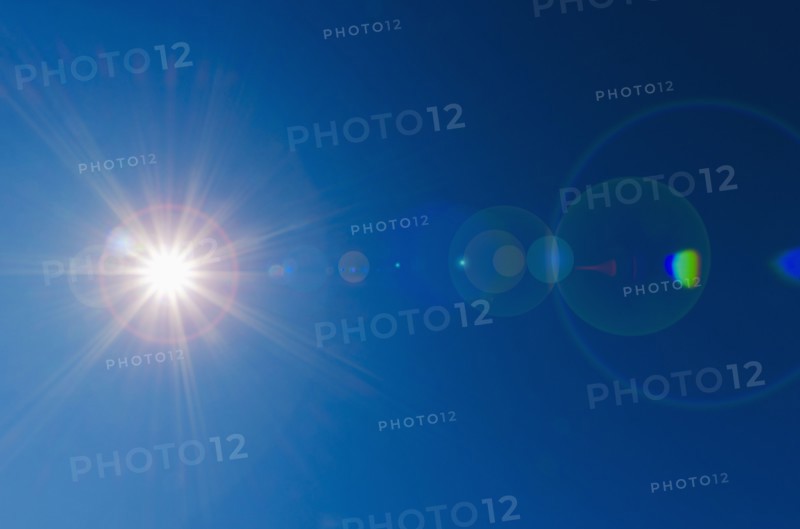 Blue sky with solar flare.