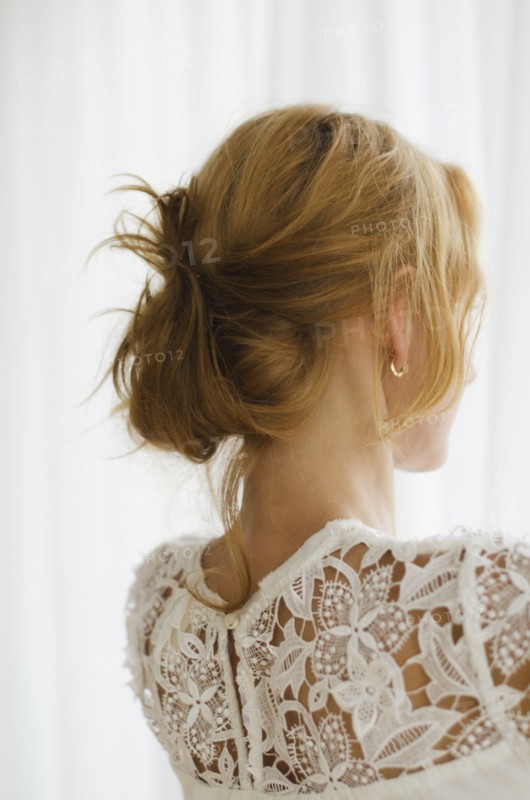 Woman looking out window.