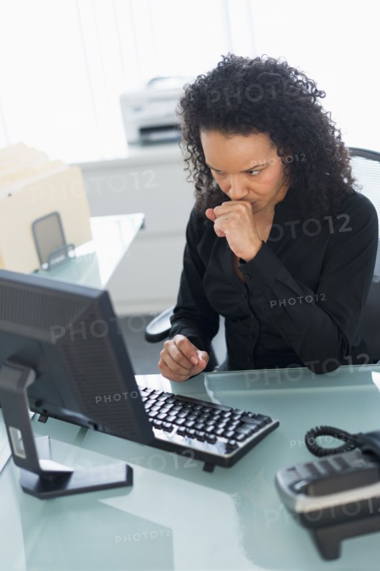 Business woman using computer.