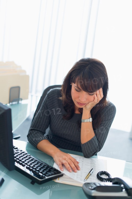 Business woman reading documents.