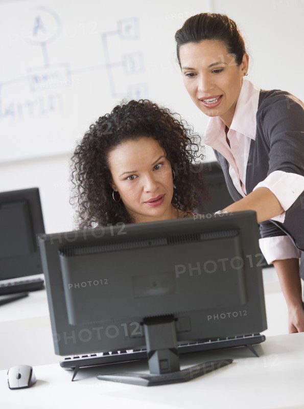 Business women using computer in office.