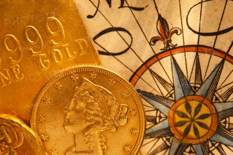 Antique map and coins, studio shot.
