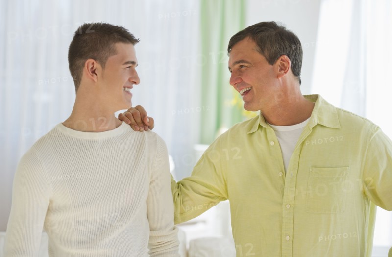 Father and son (16-17) talking.