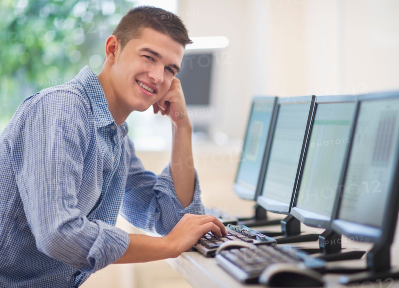 Teenage student (16-17) in computer lab.