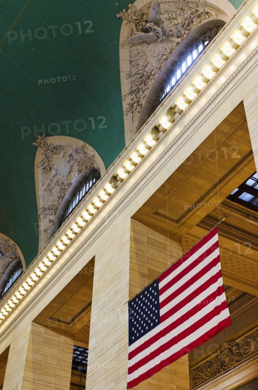 USA, New York State, New York City, Interior of Grand Central Station with American flag.