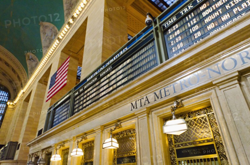 USA, New York State, New York City, Interior of Grand Central Station with American flag.