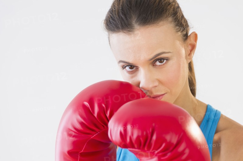 Studio shot of woman boxing.