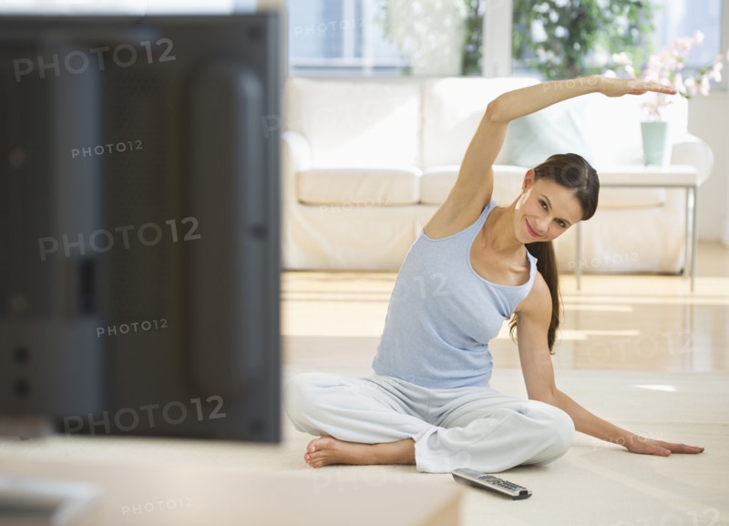 Woman exercising at home.